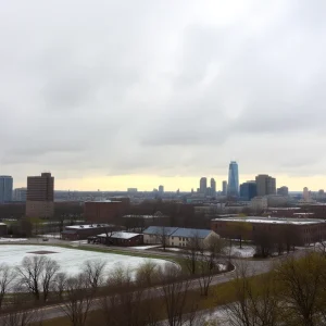 Cityscape of Metro Detroit showing a mix of rain and snow under cloudy skies