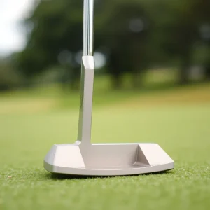 A premium golf putter on a putting green