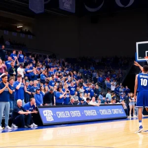 Michigan Wolverines basketball fans in blue at Crisler Center