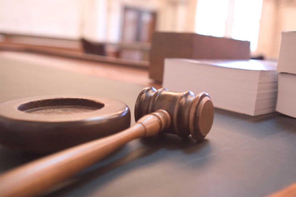 Wooden gavel resting on a courtroom surface