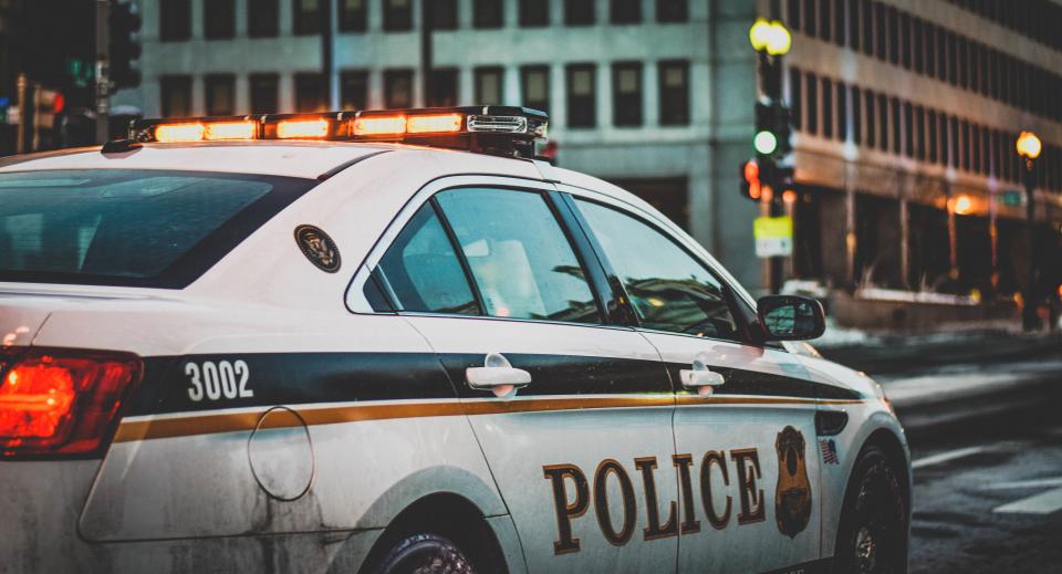 Police car with emergency lights at night
