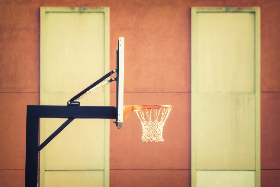 Basketball hoop against a brick wall