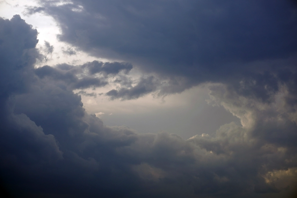 Dark storm clouds over open water